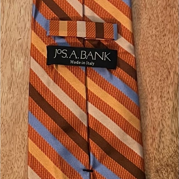 JOS A. BANK MEN’S ORANGE, BROWN, BLUE, & CREME 100% SILK NECKTIE/PRE-OWNED/BOUND - Picture 2 of 2